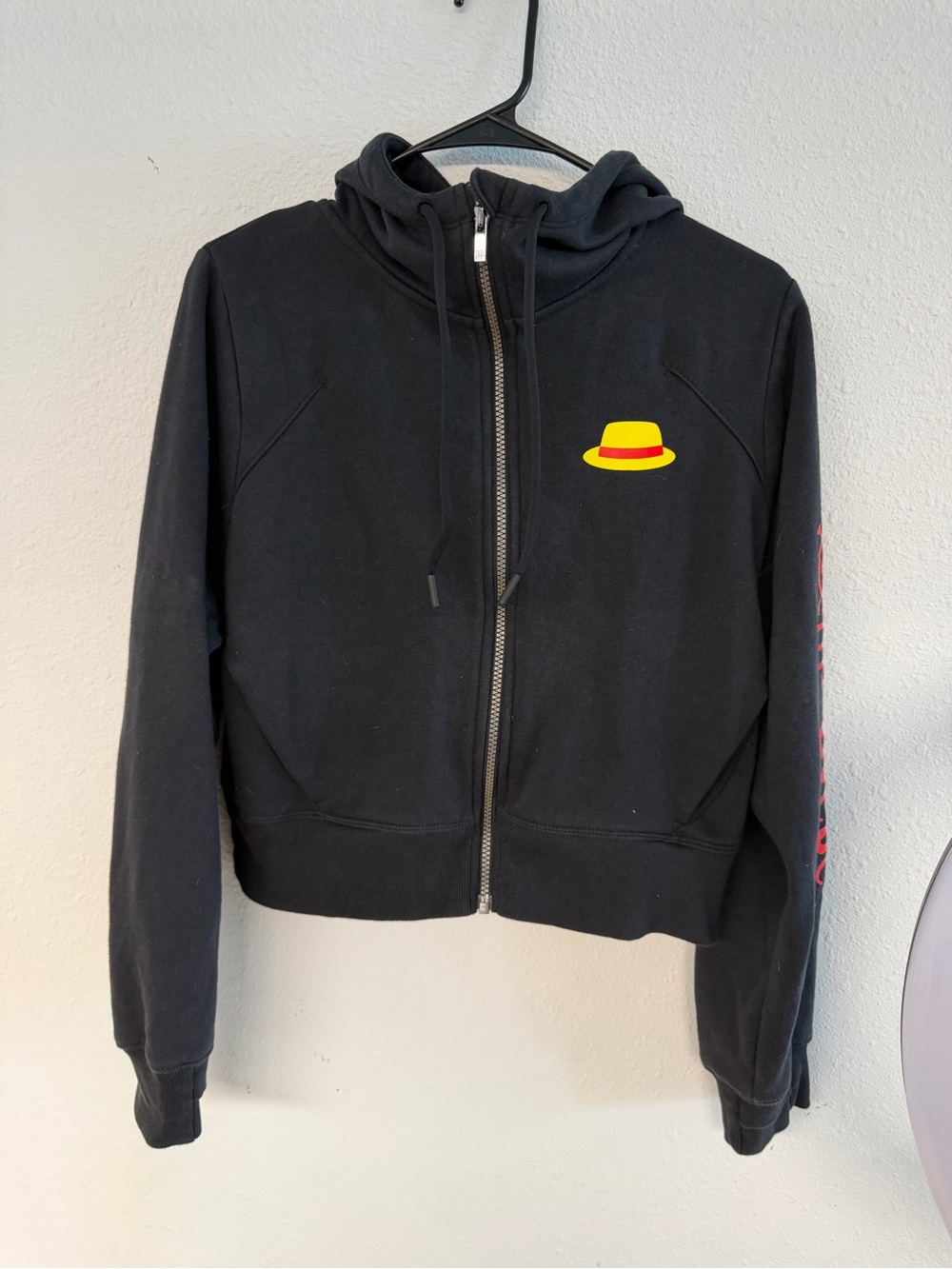 Black Zip-Up One Piece Hoodie with Yellow & Red Hat Graphic